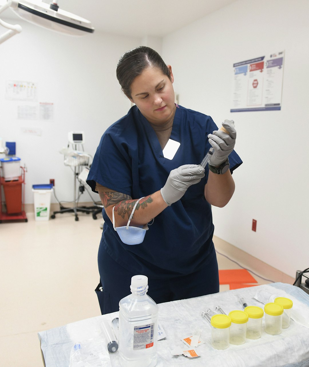 About JACKSONVILLE, FL. (October, 19, 2023) Hospital Corspman 2nd Class Nicole Gleba, a respiratory therapist at Naval Hospital Jacksonville, sets up for a bronchoscopy procedure. Gleba, a native of Cleveland, Ohio, says, “I believe the best part of my job is taking care of patients in their time of need and being a part of the team to help return them to their best.” Respiratory Care Week, October 22 – 28, recognizes this profession for its vital role in healthcare, especially during a pandemic. (U.S. Navy photo by Deidre Smith, Naval Hospital Jacksonville).#FacesofNHJax